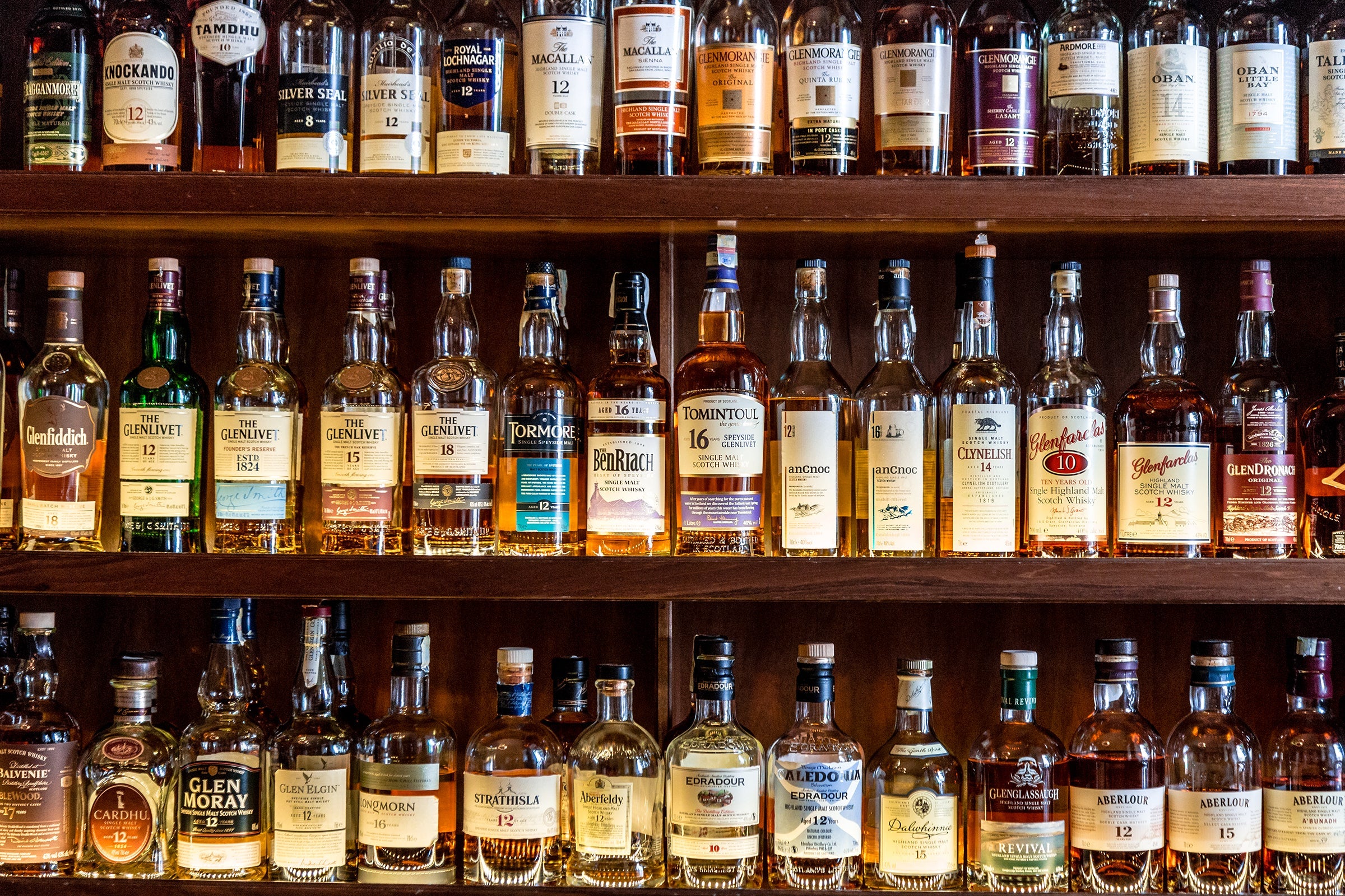 An organised whisky collection.
