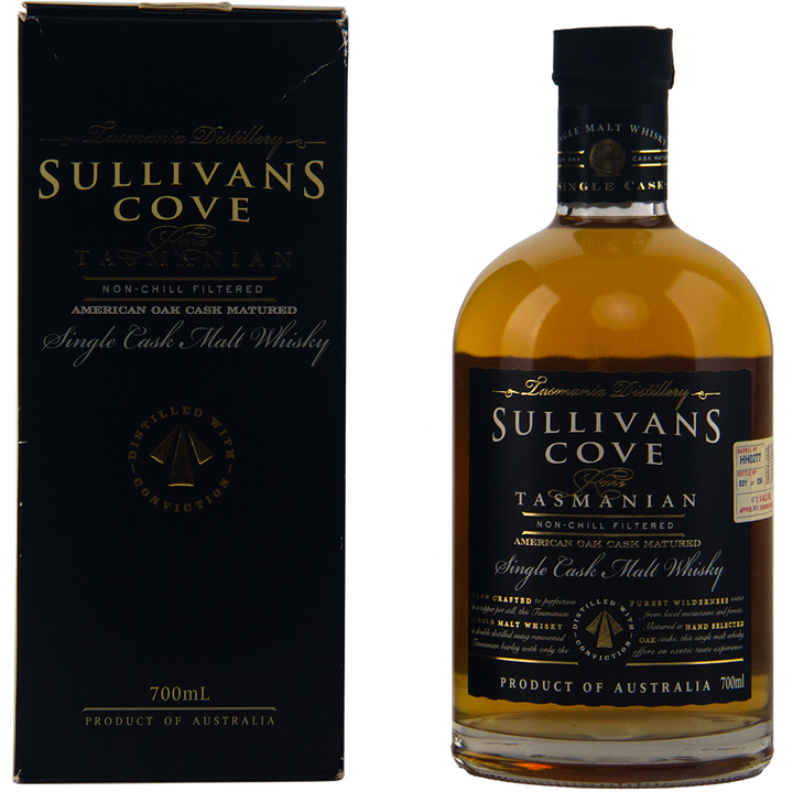 A bottle of Sullivans Cove 14 year old American Oak Cask HH0277 whisky stands beside its black and gold box. The 700ml bottle features a detailed label with gold and white text.