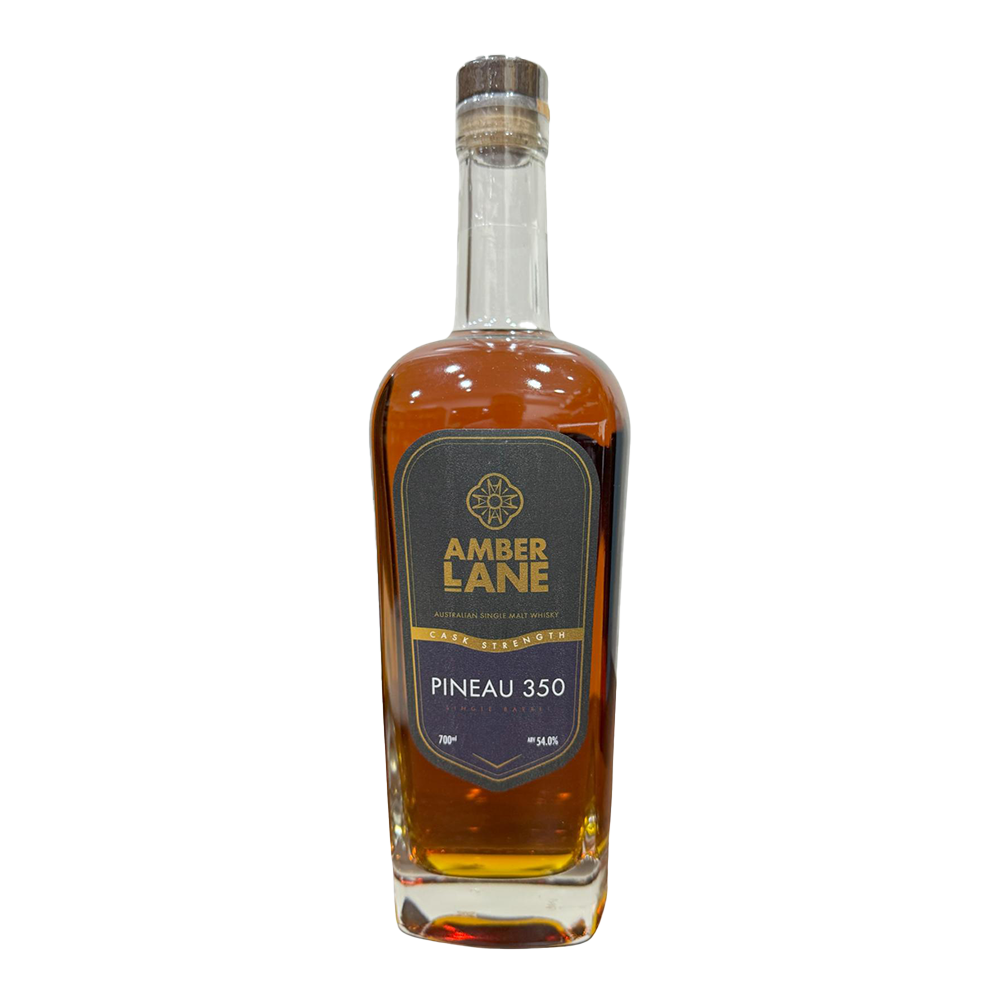 An amber-hued glass bottle labeled Amber Lane Pineau 350 Australian Single Malt Whisky, with a dark gray label, gold accents, and wooden cap, stands on a white background; the whisky is finished in Pineau des Charentes cask.
