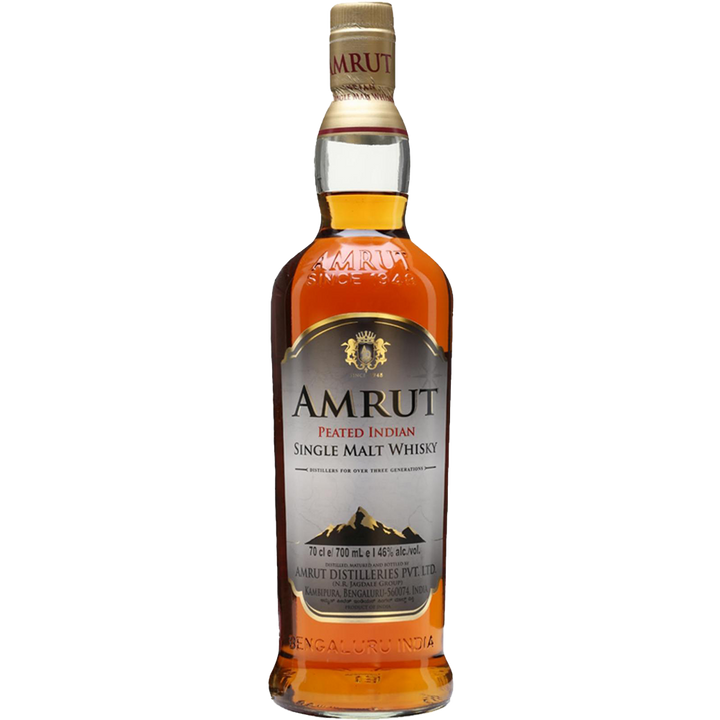 A bottle of Amrut Peated Indian Single Malt Whisky featuring a gold and white label with a mountain graphic and gold text, filled with rich amber peated whisky.