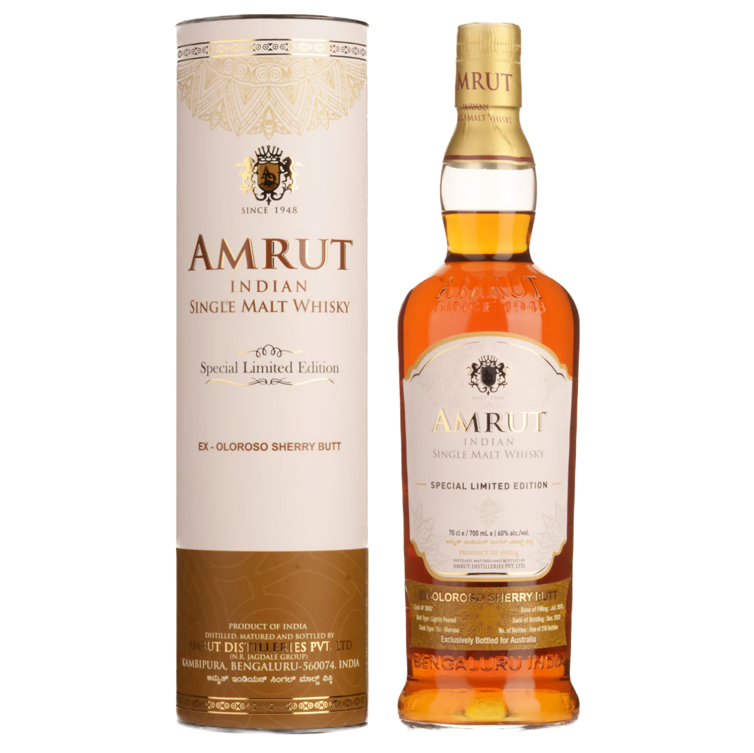 A bottle of Amrut Oloroso Cask #3897 Indian Single Malt Whisky stands beside its matching cylindrical box, both adorned with gold and brown details emphasizing its sherry cask-aged character.