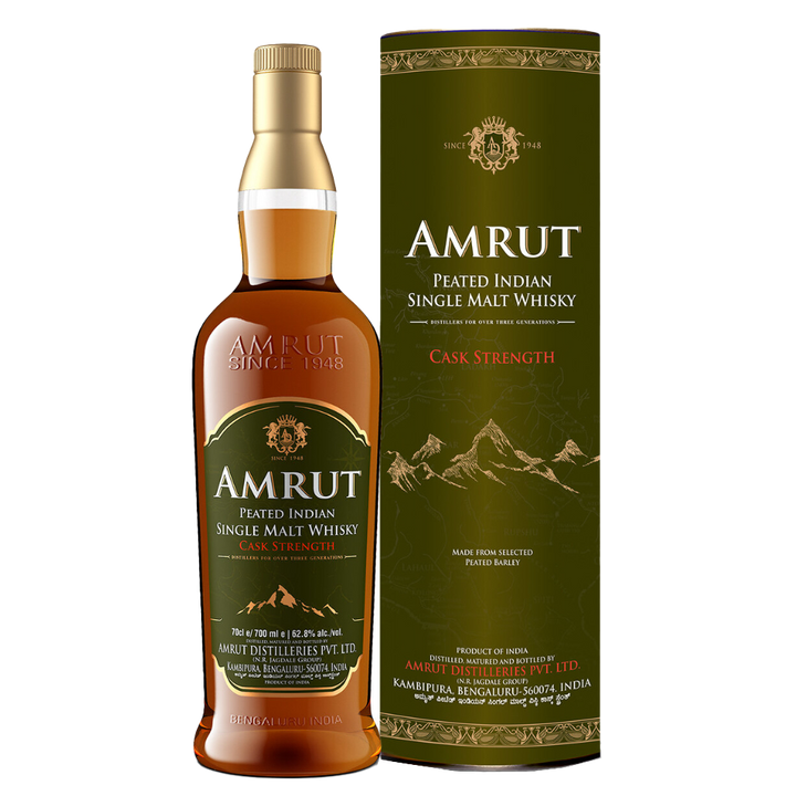 A bottle of Amrut Peated Cask Strength Indian Single Malt Whisky with its cylindrical box, showcasing gold and white text plus mountain illustrations on a dark green background.