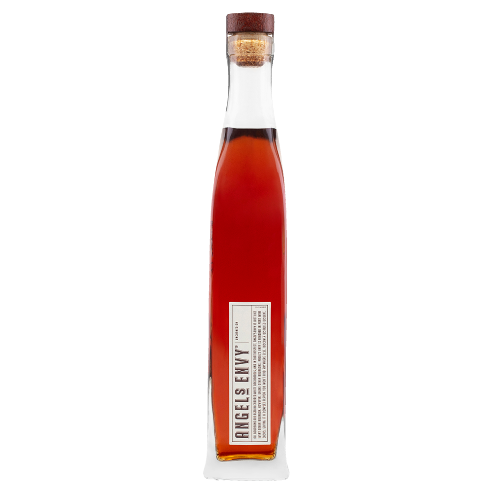 A tall, slender glass bottle of Angel's Envy Kentucky Straight Bourbon Whiskey with a cork stopper and rectangular label near the base. The amber bourbon, finished in port wine casks, is set against a plain white background.