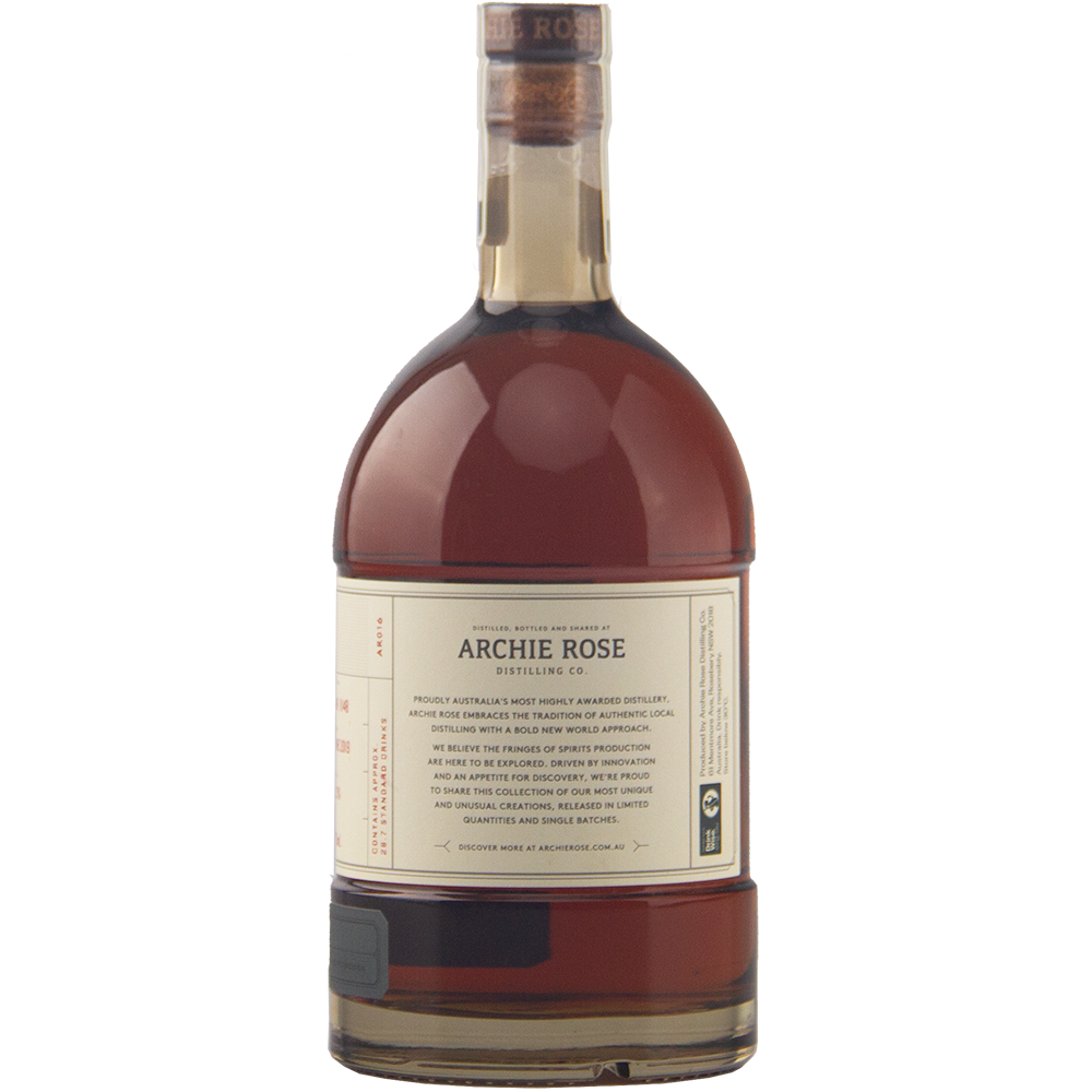 A 700ml bottle of Archie Rose Chocolate Rye Malt Whisky with dark amber liquid, cork-sealed and featuring a cream and gold label, is shown on a plain white background.