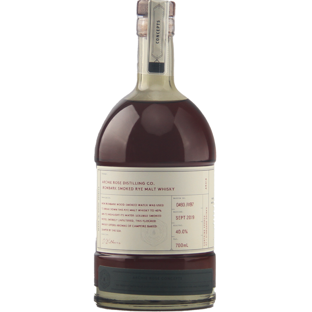A limited-edition 700ml bottle of Archie Rose Ironbark Smoked Rye Malt Whisky features a cream label, handwritten details, wax-sealed cap, and contains dark amber spirit at 40% ABV.