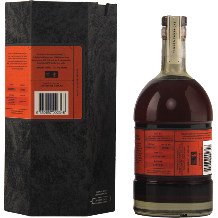 A dark glass bottle of Archie Rose Red Gum Smoked 700ml with a wide base and short neck stands beside its black textured box, both featuring orange labels that highlight the Australian native smoked malts and a visible barcode on the box.