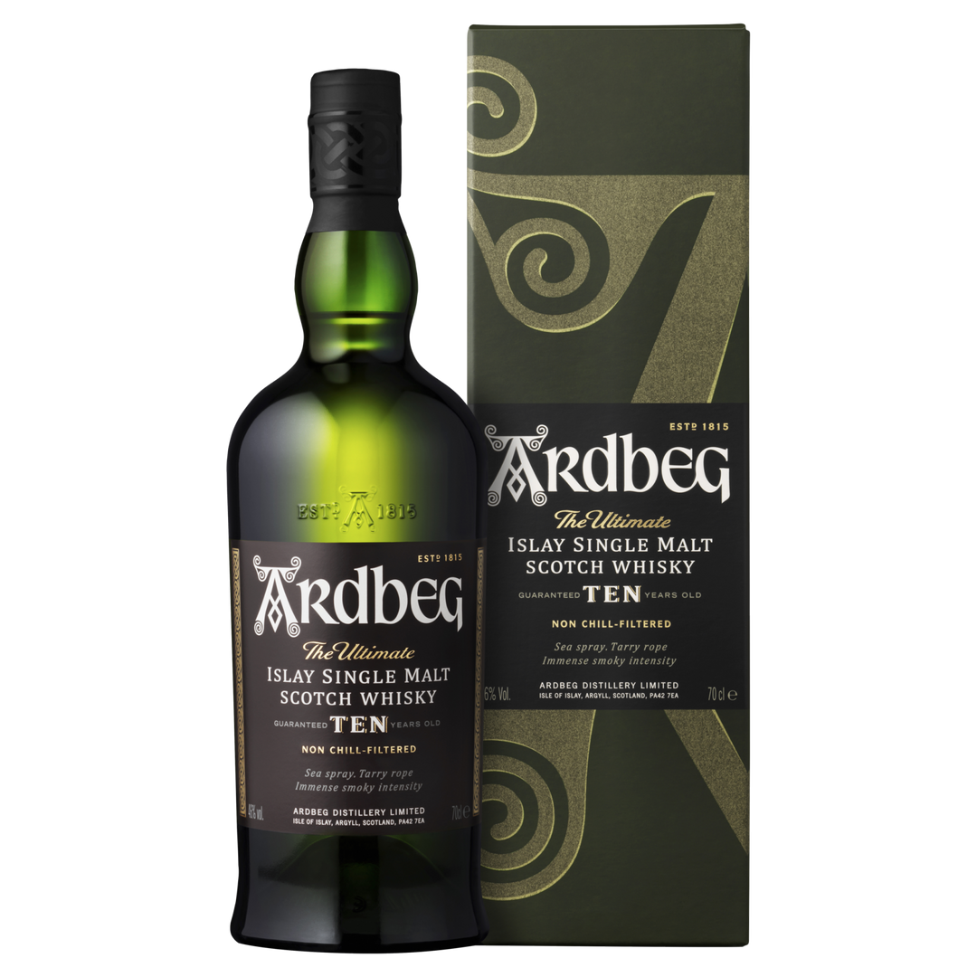 A bottle of Ardbeg 10 Year Old Single Malt Scotch Whisky is displayed beside its green and gold box, both featuring white and gold text and swirling design accents.