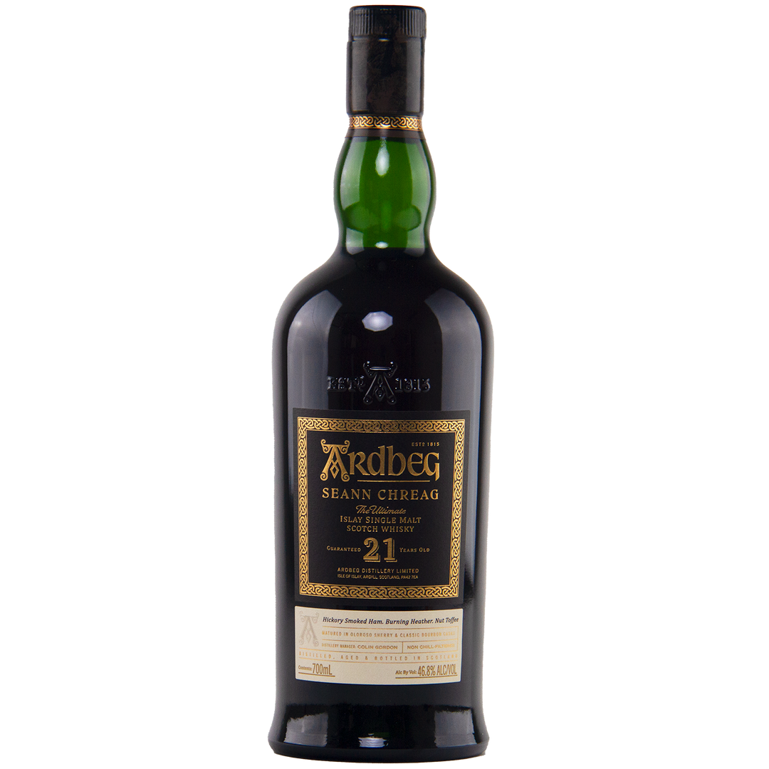 Ardbeg 21 Year Old Seann Chreag Single Malt Scotch Whisky comes in a dark green bottle with a black and gold label, black cap, and gold embossing, reflecting its limited edition peated Islay character aged 21 years.