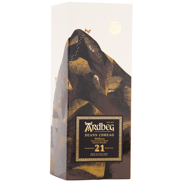 Ardbeg 21 Year Old Seann Chreag Single Malt Scotch Whisky comes in a tall, rectangular box with a black and gold label. The box features a gold-accented illustrated mountain, a goat at its peak under a gold sun—true Islay peated whisky prestige.