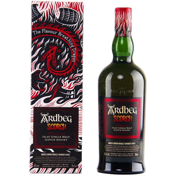 A bottle of Ardbeg Scorch Single Malt Scotch Whisky Ardbeg Day 2021 Limited Release stands beside its bold dragon-themed box with red, black, and white accents. This peaty limited edition is as striking as its fiery packaging.