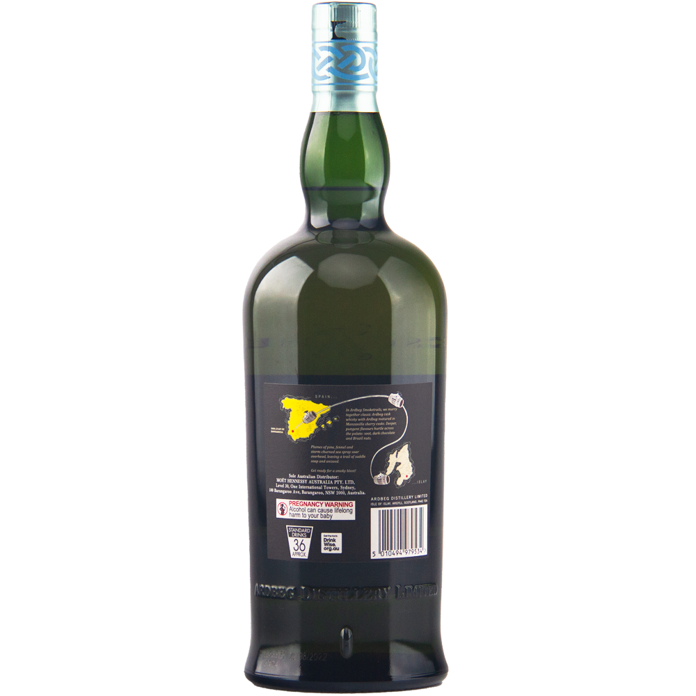 A green glass Ardbeg Smoketrails Manzanilla Edition 700ml bottle is shown from the back, with a label featuring a yellow map, text, graphics, and a light blue patterned cap—exclusive to travel retail.
