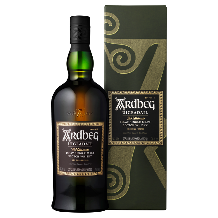 A bottle of Ardbeg Uigeadail Single Malt Scotch Whisky stands beside its matching box, both displaying the Ardbeg logo and label details. This celebrated peated whisky is pictured against a light background.