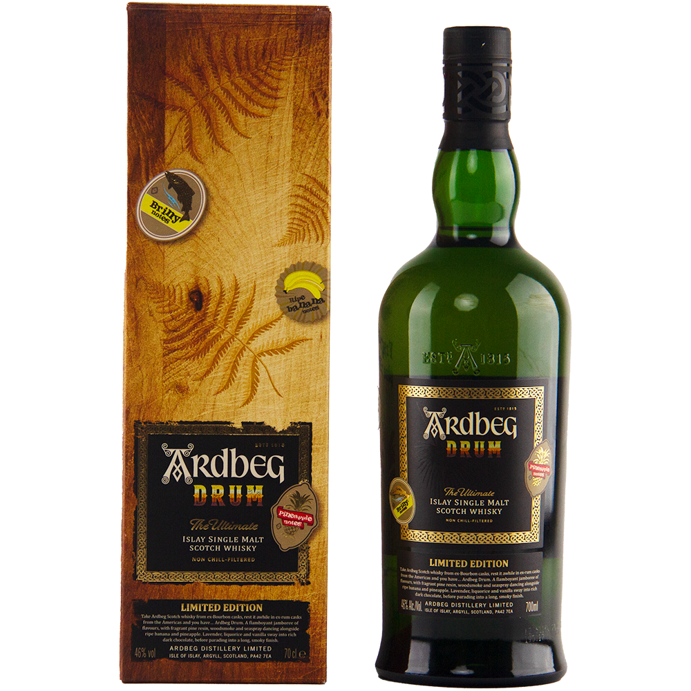 A bottle of Ardbeg Drum Single Malt Scotch Whisky, a limited edition peated Islay malt, is shown beside its wood-textured box, both adorned with gold and black labels featuring the iconic Ardbeg branding.