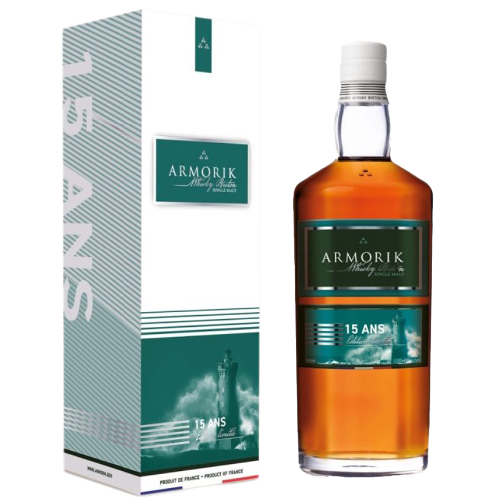 A bottle of Armorik 15 Ans (15 Year Old) French Single Malt Whisky with a green and white label stands beside its box, both displaying a lighthouse and bold silver "15 ANS," highlighting the whisky's sherry cask maturation.