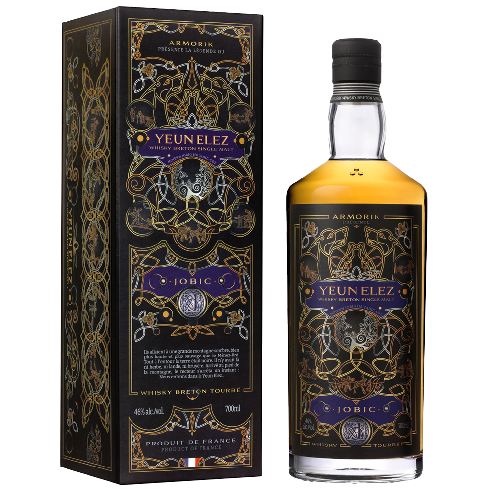 A bottle of Armorik Yeun Elez Jobic French Single Malt Whisky stands beside its ornate black and gold box, both decorated with geometric and nature-inspired mystical designs. The label showcases striking purple and gold accents.