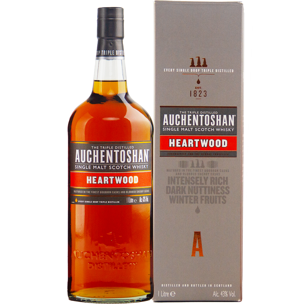 A 1L bottle of Auchentoshan Heartwood Single Malt Scotch Whisky, a travel retail exclusive, stands beside its grey box, both featuring the brand and product details in red, white, and gold.