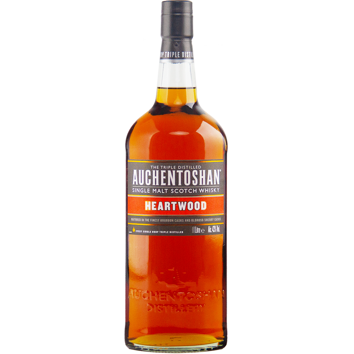 A 1L bottle of Auchentoshan Heartwood Single Malt Scotch Whisky, a travel retail exclusive at 43% ABV, featuring dark amber liquid and a black, white, and orange-accented label with a black cap.