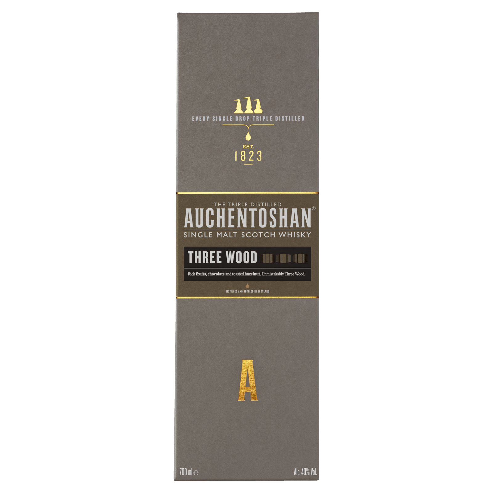 A box of Auchentoshan Three Wood Single Malt Scotch Whisky features gold and white text on a gray background, prominently displaying the brand logo, whisky details, and highlighting its triple maturation process.