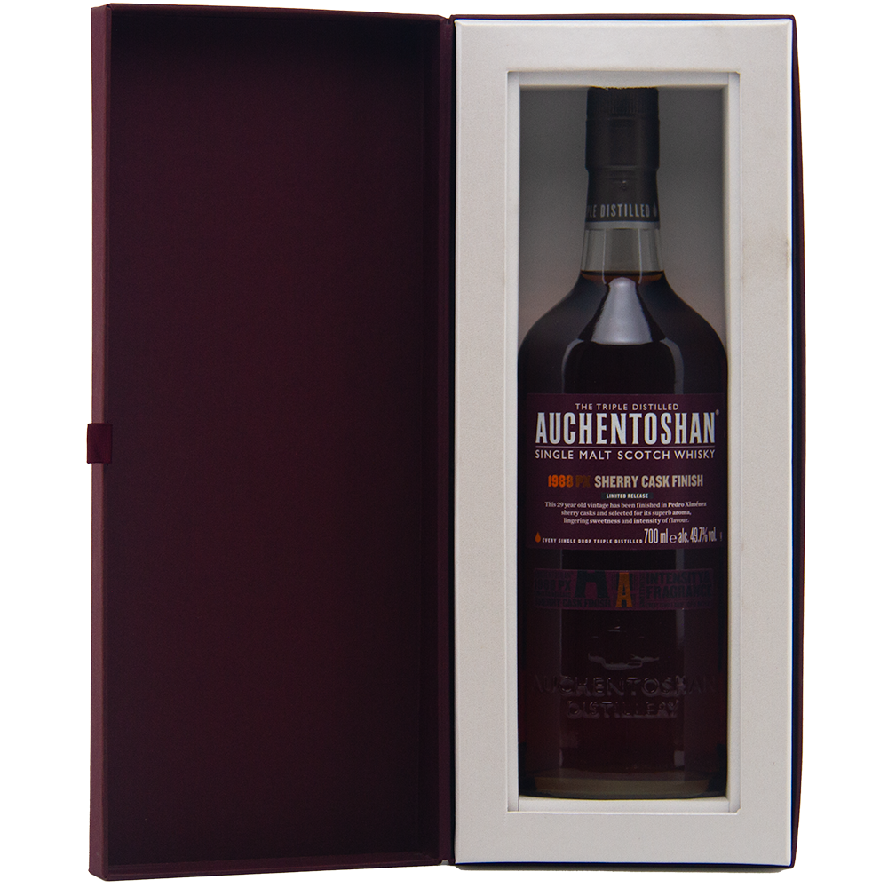 A bottle of Auchentoshan 1988 PX Sherry Cask Finish Single Malt Scotch Whisky comes in a gift box with a clear window and dark red interior, highlighting Pedro Ximénez sherry notes and the whisky’s signature smooth triple distillation.