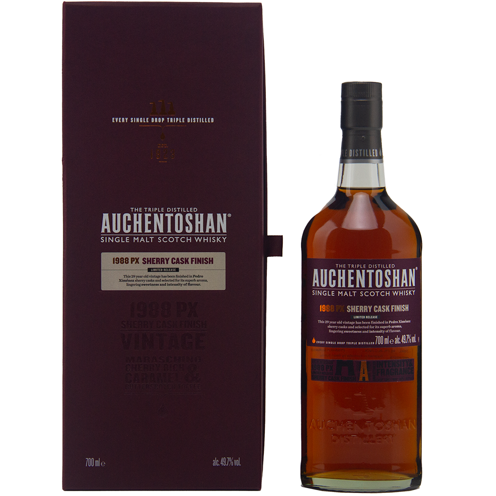 A bottle of Auchentoshan 1988 PX Sherry Cask Finish Single Malt Scotch Whisky, triple distilled and matured in Pedro Ximénez sherry casks, stands next to its dark purple box with silver and gold text on a plain background.