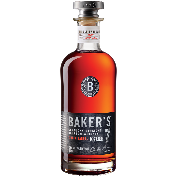 A bottle of Baker’s 7 Year Old Single Barrel Bourbon features rich amber bourbon in clear glass with a black and silver label and silver cap, displayed against a plain white background.