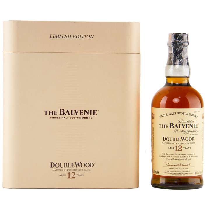 A bottle of The Balvenie 12 Year Old DoubleWood Vietnam Limited Edition Gift Set Single Malt Scotch Whisky stands beside its tan box, both showcasing gold and black text with detailed product information.