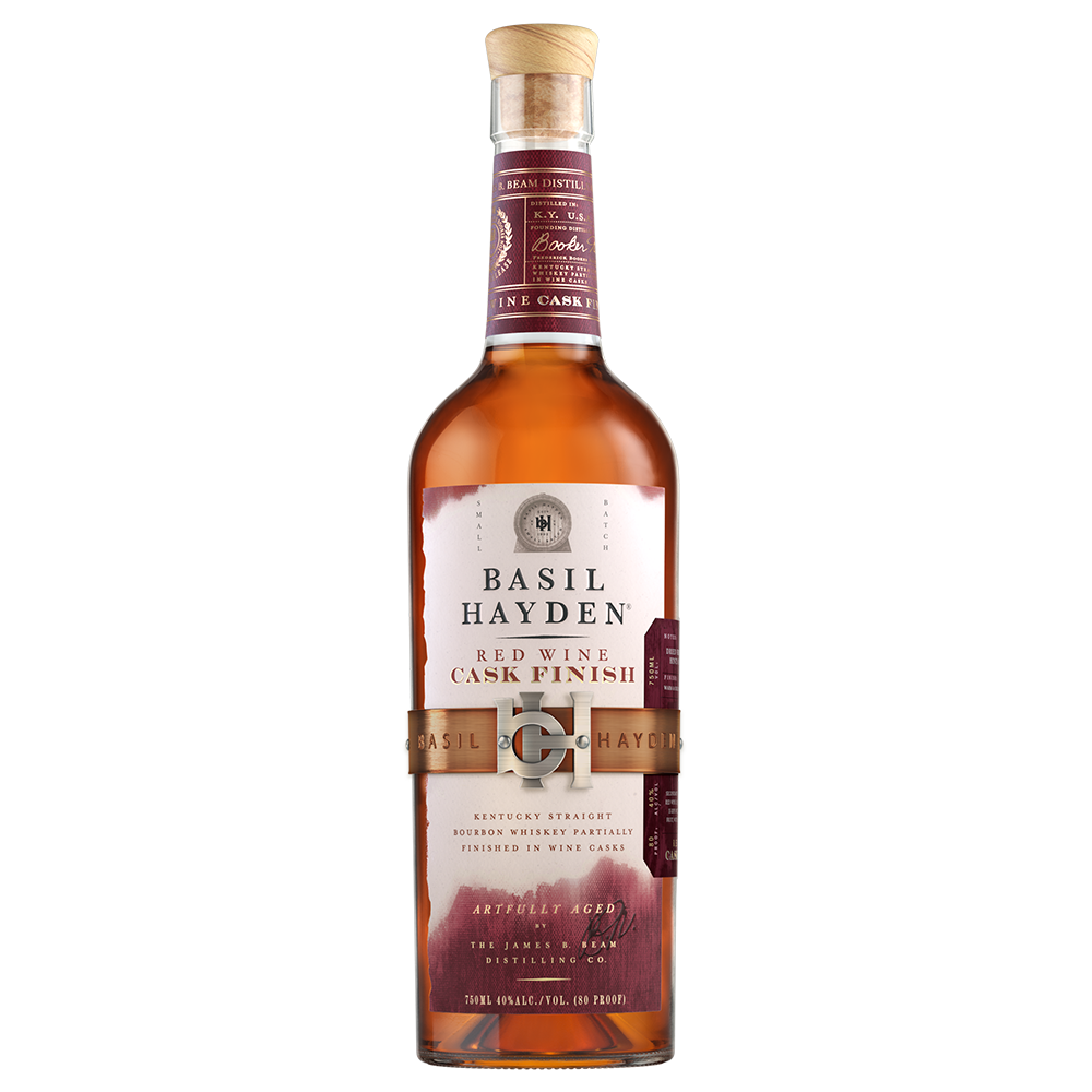 A bottle of Basil Hayden Red Wine Cask Finish Bourbon, presented in a tall glass bottle with a maroon and gold label, wooden cap, and a gold belt around the center.