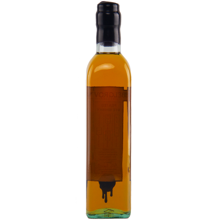 Bottle of amber liquid with a black cap on a white background