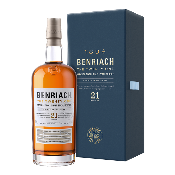A bottle of Benriach The Twenty One Single Malt Scotch Whisky stands next to its blue box, showcasing detailed labeling and amber spirit crafted from a blend of peated and unpeated malt.