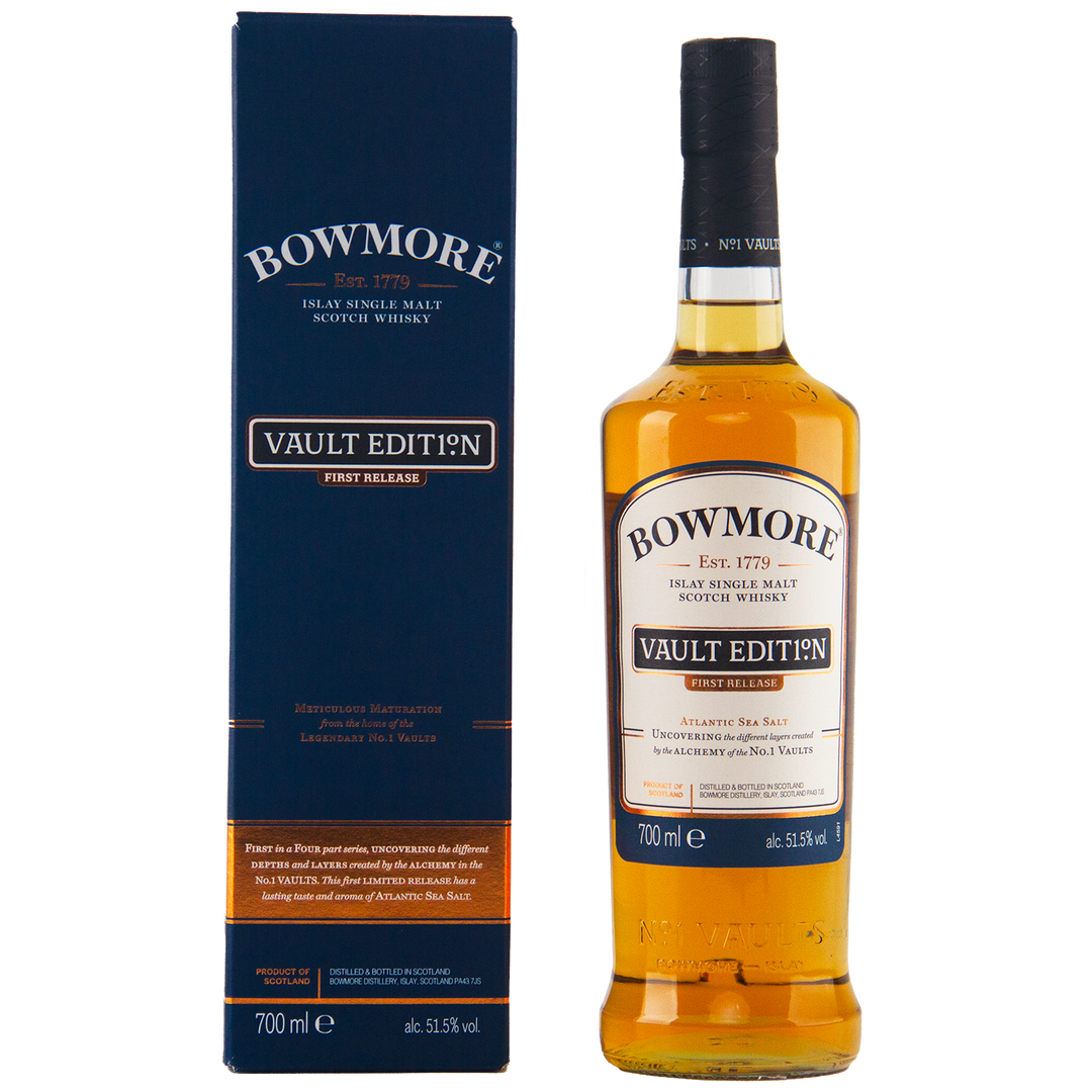 A bottle of Bowmore Vault Edition Atlantic Sea Salt (First Release) Single Malt Scotch Whisky stands next to its blue box. Both feature gold and white text, celebrating the No.1 Vaults. The bottle holds 700ml at 51.5% ABV.