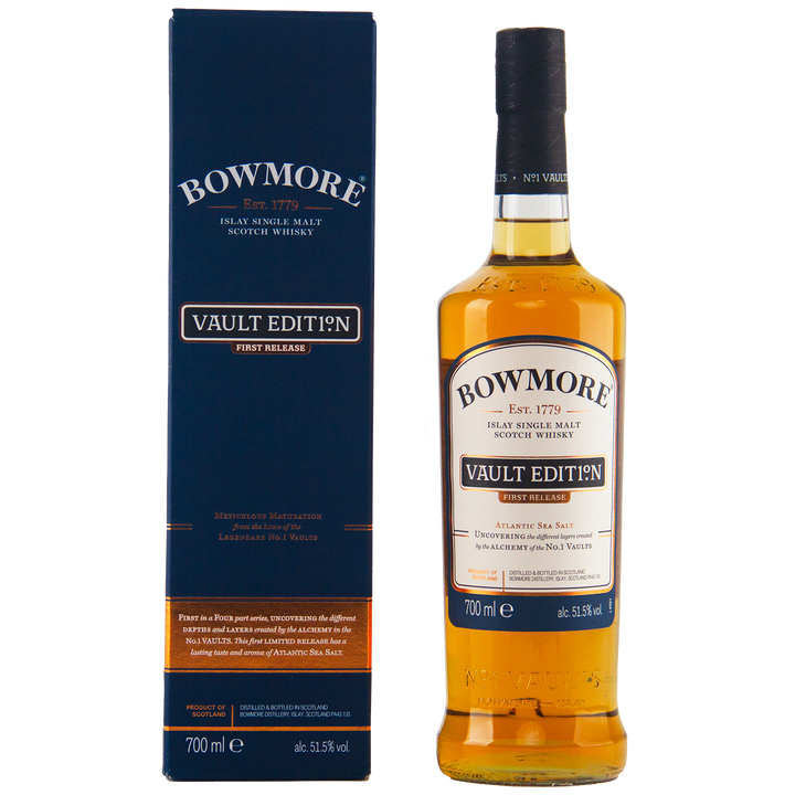A bottle of Bowmore Vault Edition Atlantic Sea Salt (First Release) Single Malt Scotch Whisky stands next to its blue box. Both feature gold and white text, celebrating the No.1 Vaults. The bottle holds 700ml at 51.5% ABV.