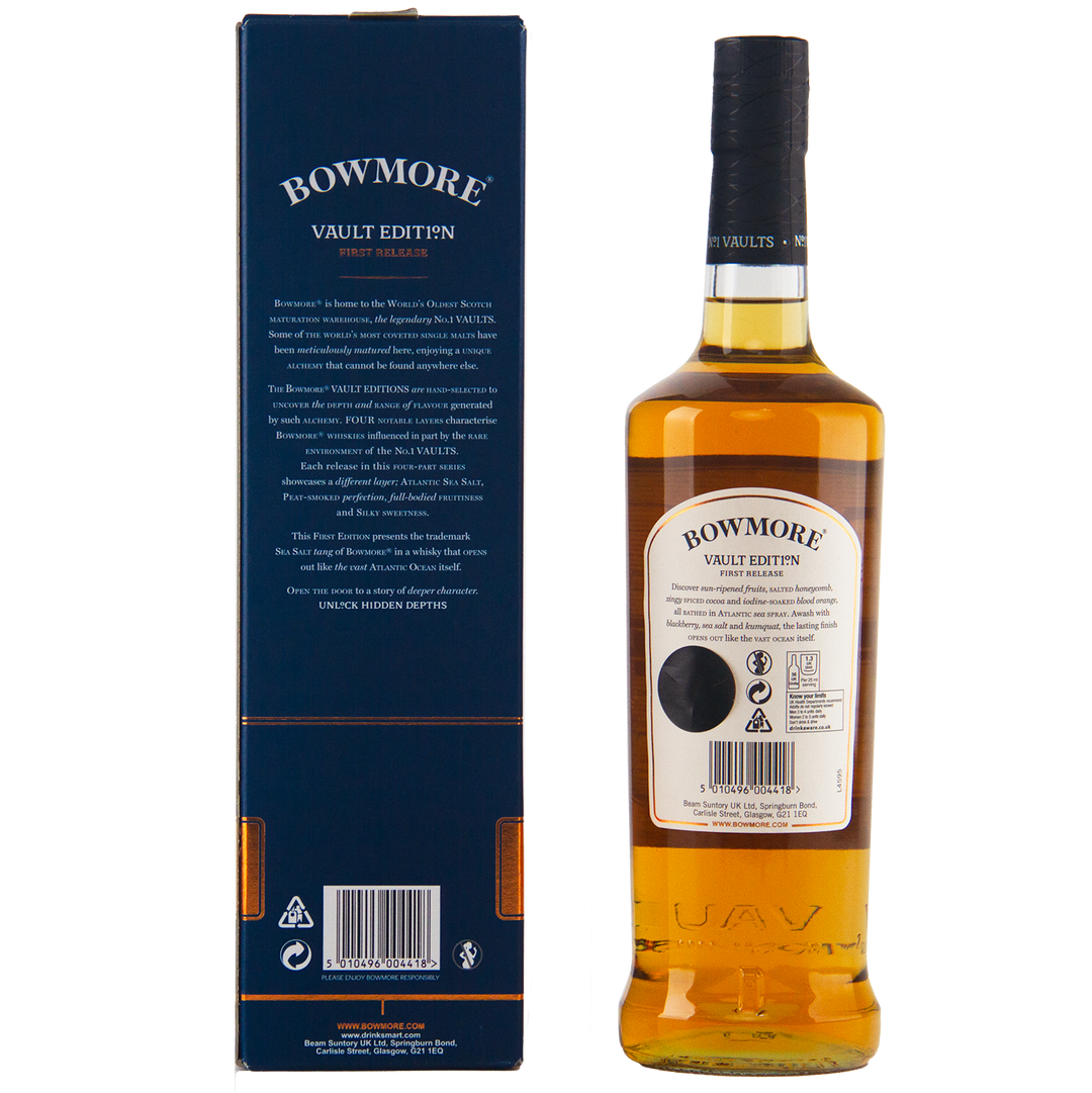A bottle of Bowmore Vault Edition Atlantic Sea Salt (First Release) Single Malt Scotch Whisky stands beside its blue box, both displaying the No.1 Vaults name and crisp white labels. The whisky inside gleams with a rich amber hue.