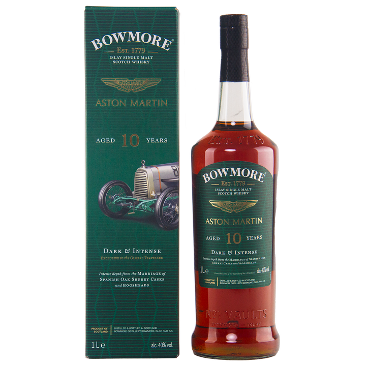 A bottle of Bowmore 10 Year Old Aston Martin Edition 7 Single Malt Scotch Whisky stands beside its green box, adorned with vintage car artwork and gold and white text highlighting this limited edition whisky.