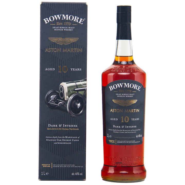 A bottle of Bowmore 10 Year Old Aston Martin Edition #4 Single Malt Scotch Whisky stands beside its branded box, both with gold and black labels featuring "Aged 10 Years" and dynamic car imagery on the box.
