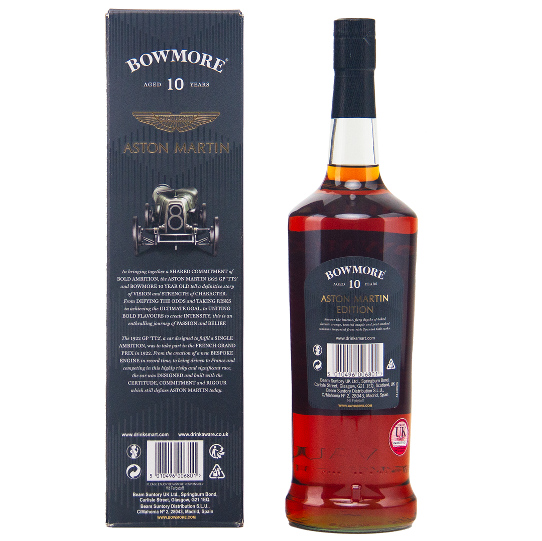 A bottle of Bowmore 10 Year Old Aston Martin Edition #4 Single Malt Scotch Whisky stands beside its matching box, adorned with gold text, a classic car graphic, the Aston Martin logo, and detailed product information.