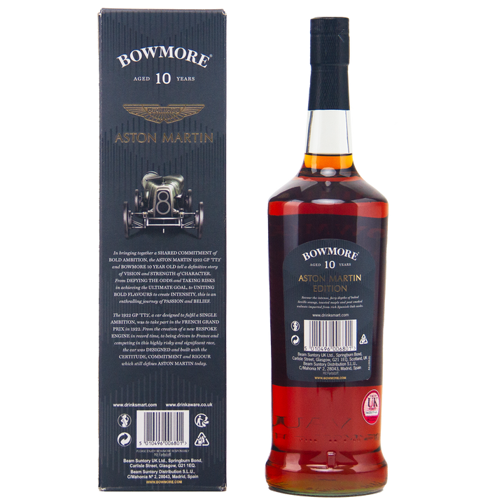 A bottle of Bowmore 10 Year Old Aston Martin Edition #4 Single Malt Scotch Whisky stands beside its matching box, adorned with gold text, a classic car graphic, the Aston Martin logo, and detailed product information.