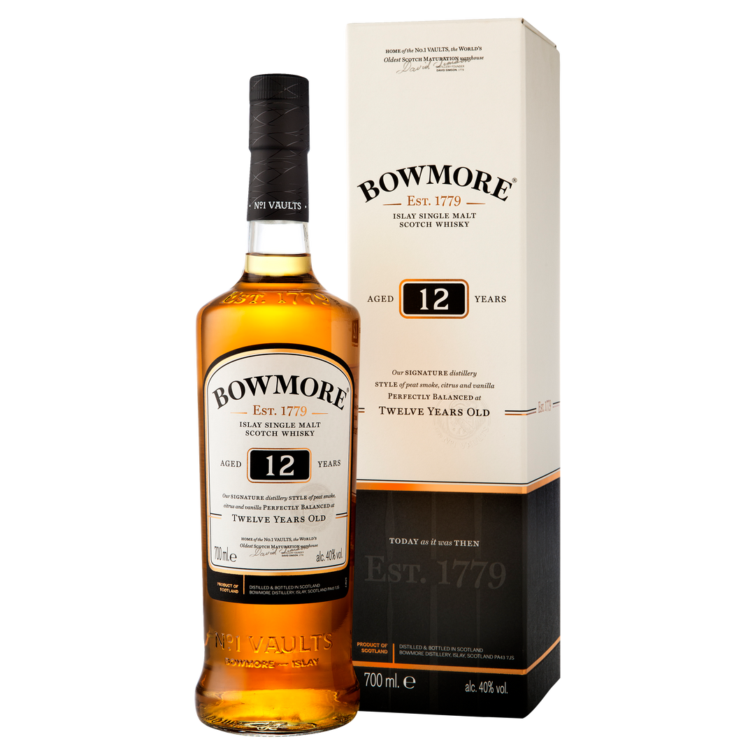 A 700ml bottle of Bowmore 12 Year Old Single Malt Scotch Whisky stands before its matching cream and black box, featuring a label that highlights its age, Islay origins, signature balance, and 40% ABV.