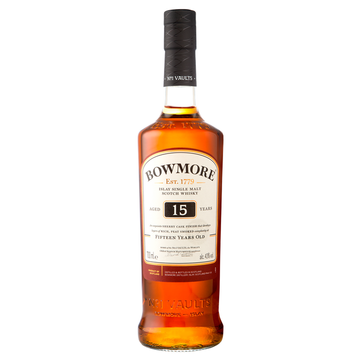 A bottle of Bowmore 15 Year Old Single Malt Scotch Whisky featuring a black cap, amber liquid, and a cream-colored label showing the brand name, age statement, and product details.