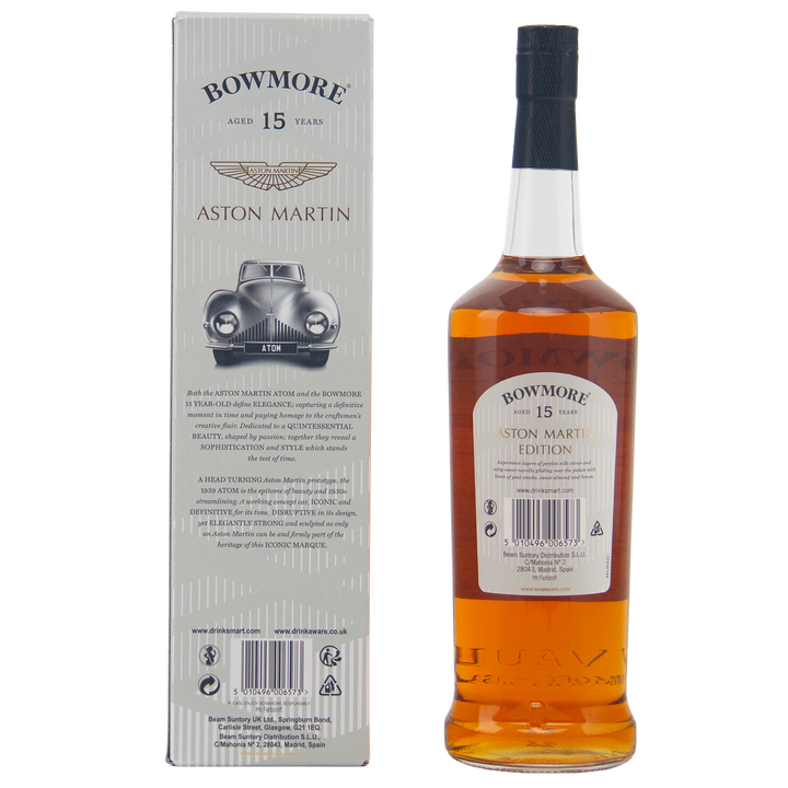A bottle of Bowmore 15 Year Old Aston Martin Edition #2 Single Malt Scotch Whisky stands beside its box, which displays a classic Aston Martin car illustration and detailed product information.
