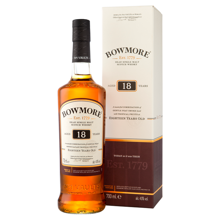 A bottle of Bowmore 18 Year Old Single Malt Scotch Whisky stands beside its cream and brown box, both featuring the product name and highlighting the whisky’s distinguished 18-year maturation.
