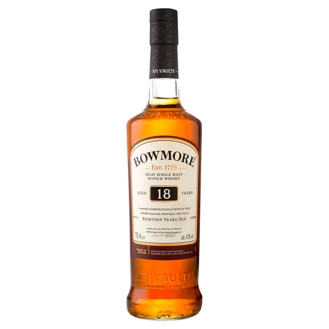 A bottle of Bowmore 18 Year Old Single Malt Scotch Whisky features a black cap, amber liquid, and a white label with the brand name and age. This single malt showcases the classic character of Islay’s renowned whiskies.