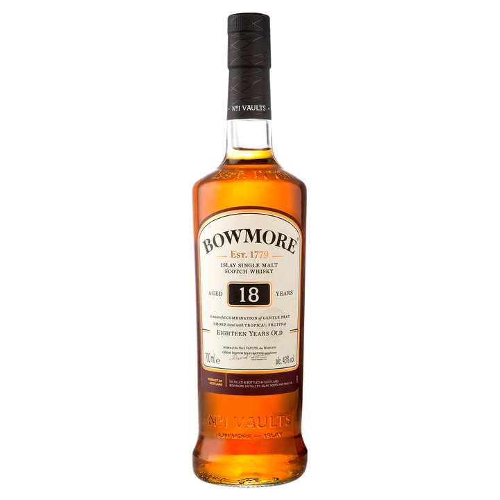 A bottle of Bowmore 18 Year Old Single Malt Scotch Whisky features a black cap, amber liquid, and a white label with the brand name and age. This single malt showcases the classic character of Islay’s renowned whiskies.