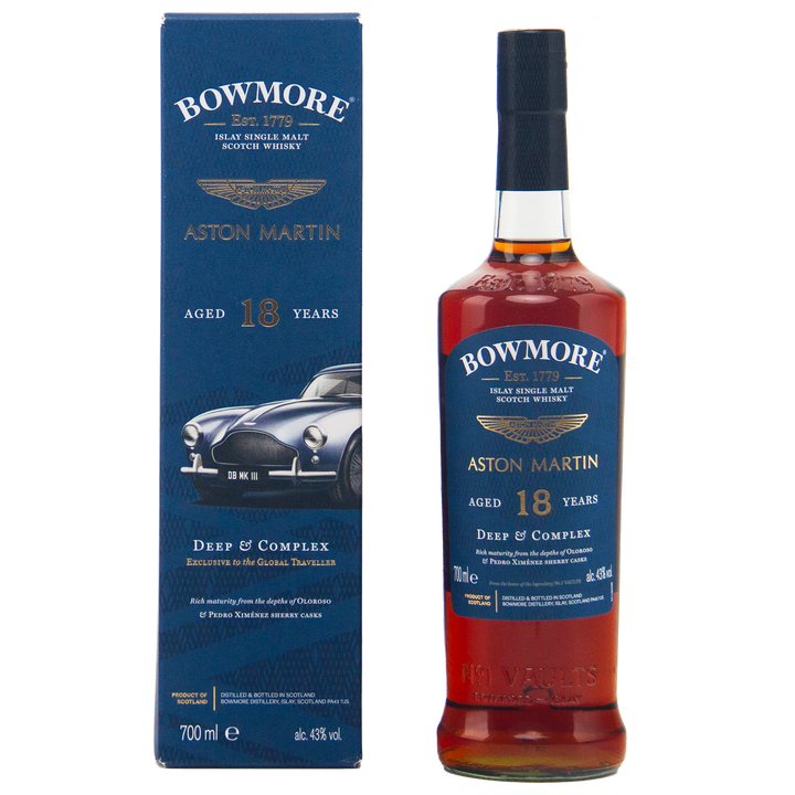 A bottle of Bowmore 18 Year Old Aston Martin Edition #3 Single Malt Scotch Whisky stands by its blue box, featuring a classic Aston Martin car illustration and gold text highlighting the whisky’s age and edition details.