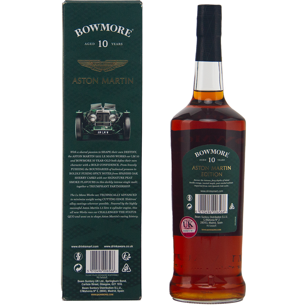 A bottle of Bowmore 10 Year Old Aston Martin Edition 1 Dark & Intense Single Malt Scotch Whisky is displayed beside its green box, decorated with a classic Aston Martin car image and gold branding.