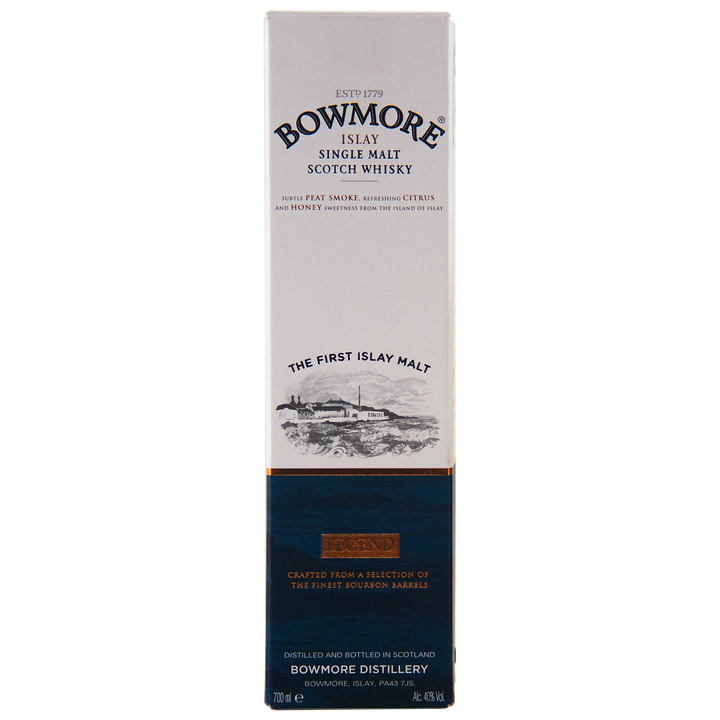 The image displays a tall, rectangular box of Bowmore Legend Islay Single Malt Scotch Whisky, mainly white with a dark blue and gold bottom section and featuring text plus a coastal distillery illustration.