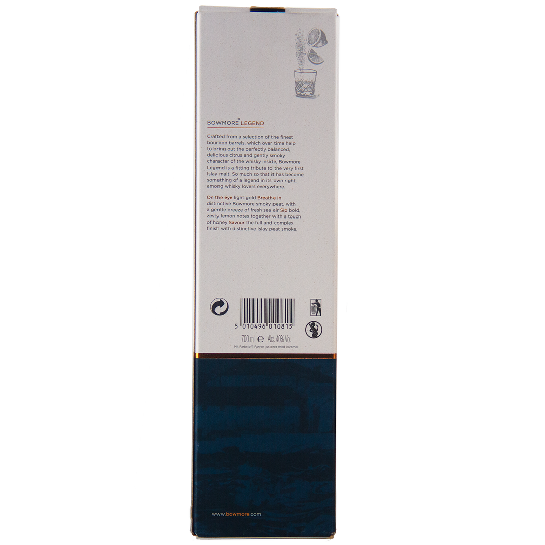 The Bowmore Legend Islay Single Malt Scotch Whisky comes in a rectangular box featuring detailed back text, barcode, and icons. The lower half is dark blue with subtle designs; the upper part is white with gold trim and small illustrations at the top.