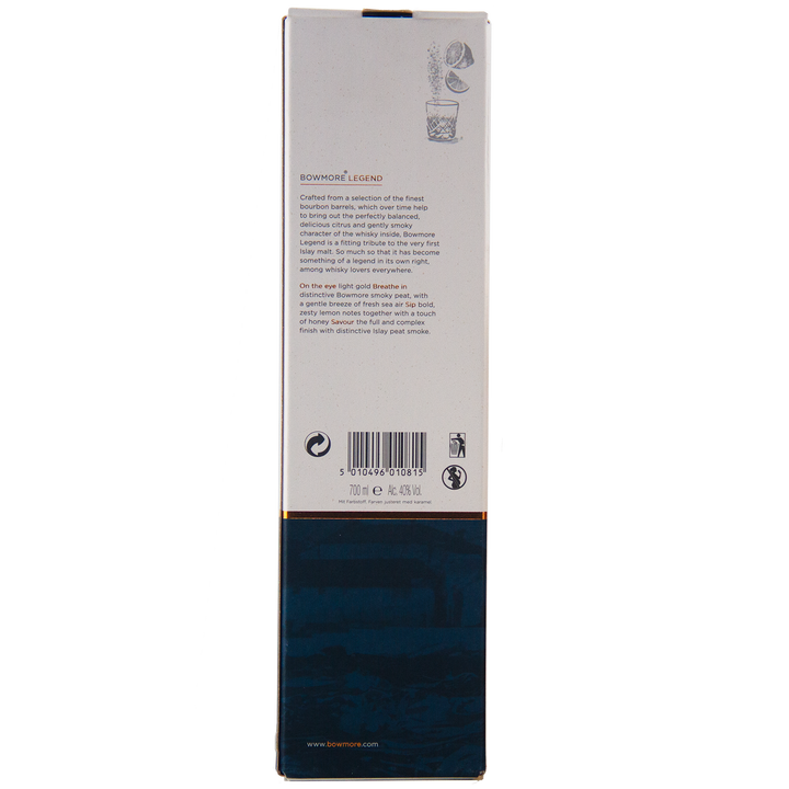 The Bowmore Legend Islay Single Malt Scotch Whisky comes in a rectangular box featuring detailed back text, barcode, and icons. The lower half is dark blue with subtle designs; the upper part is white with gold trim and small illustrations at the top.