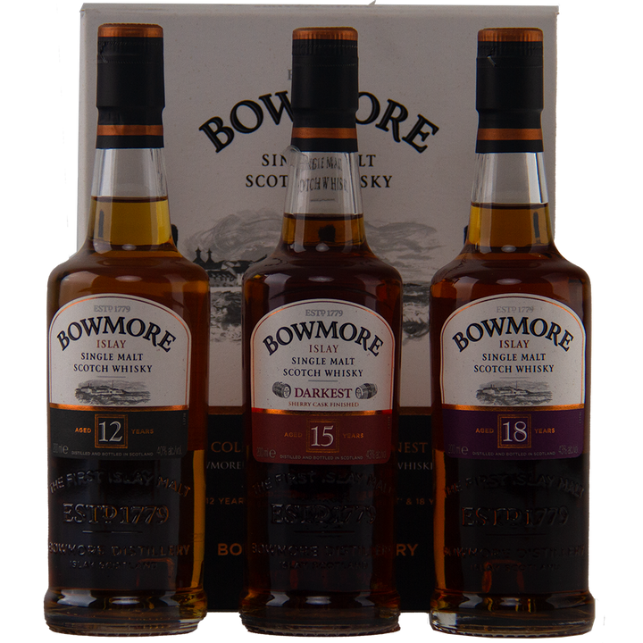 The Bowmore Collection 12, 15 & 18 Year Old (200ml Set) Single Malt Scotch Whisky features three bottles with rich amber tones and classic labels, displayed in front of a Bowmore-branded box.