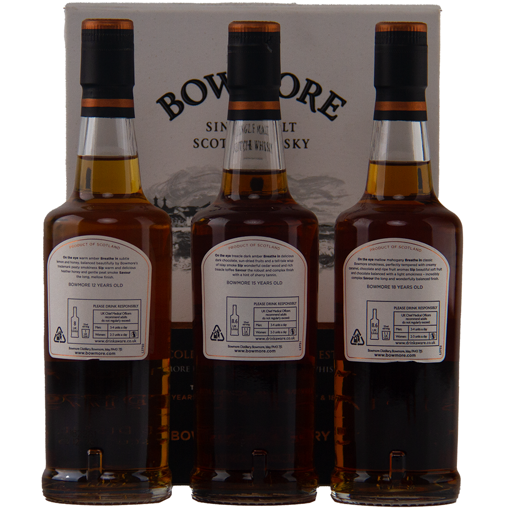 Three bottles from the Bowmore Collection 12, 15 & 18 Year Old (200ml Set) Single Malt Scotch Whisky are displayed in front of a Bowmore box, showing their back labels with product details and recycling instructions.