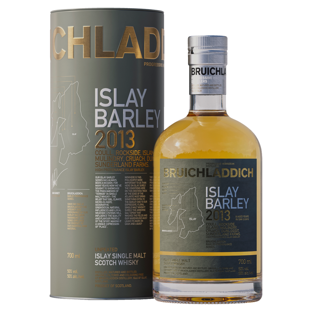 A bottle of Bruichladdich Islay Barley Single Malt Scotch Whisky stands beside its matching cylindrical box, both decorated with gold and white text, map outlines, and details about the whisky’s Islay origins and distillery.